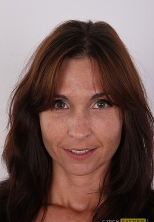 Short haired mature European woman Kitty Cream baring butt cheeks in nylons